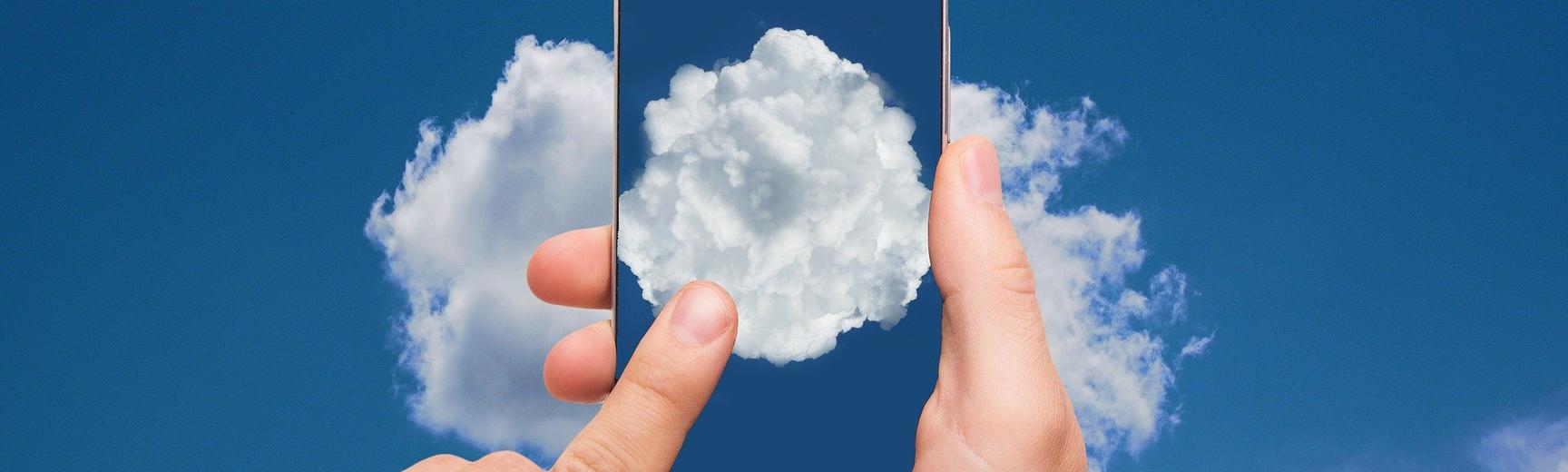 A mobile phone with a photo of a cloud